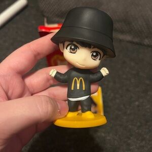 Tiny tan BTS McDonalds toy jung kook